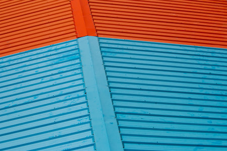orange and blue aluminum roofing sheets.の写真素材