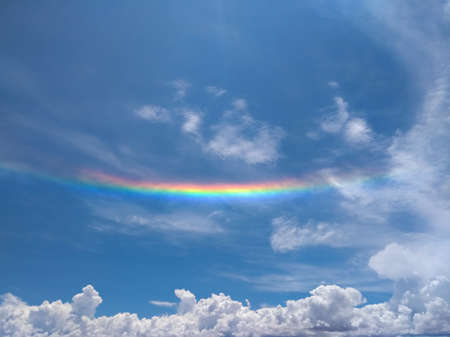 Sunshine clouds sky during morning background. Sky in a morning in Salinas Grandes, Argentina. Bright colors. Clouds and a rainbow. Scenic. Concept of peace, freedom, travel and holidays.の写真素材