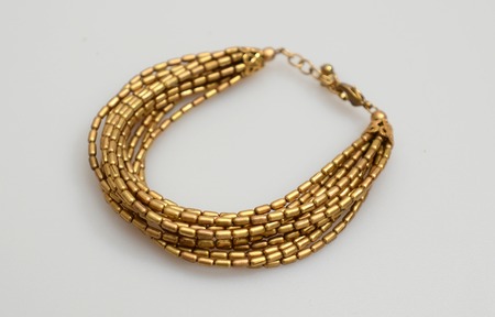 handmade woman bracelet isolated on grey backgroundの写真素材