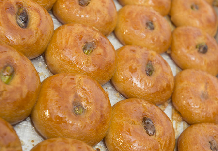 Pastries made of deep fried dough soaked in sugar syrup or honeyの写真素材