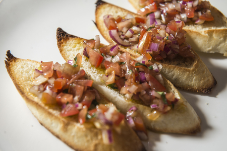 Crunchi bruscetta with tomato and onion toppingの写真素材