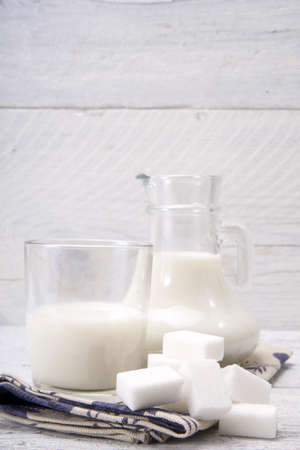 	jug and glass with milk and sugarの写真素材