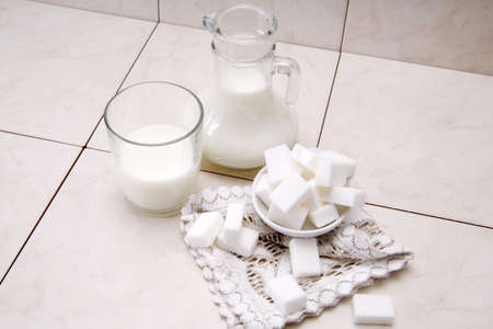 	jug and glass with milk and sugarの写真素材