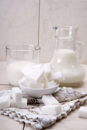 	jug and glass with milk and sugarの写真素材