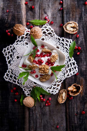Breakfast Of Yogurt Nuts And Pomegranate Seedsの写真素材