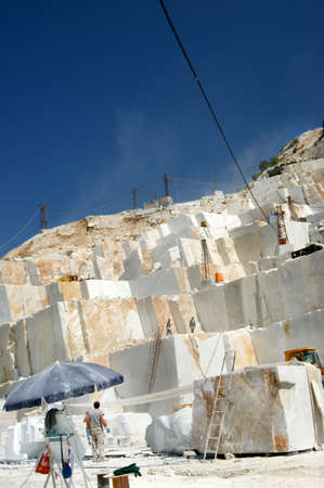 Excavation under the open sky of white marble from Carrara Italy のeditorial素材