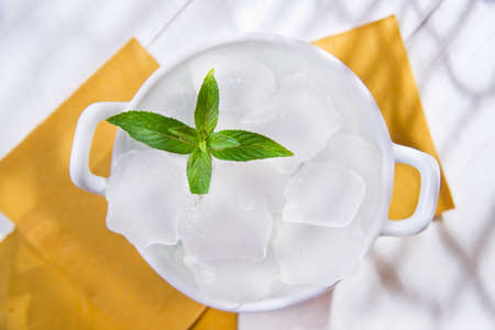 Presentation of ice cubes for drinks container の写真素材