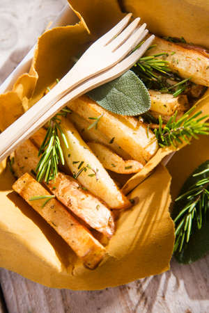 Presentation of a plate of homemade potato chips の写真素材