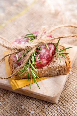 Presentation of a snack of bread and salami の写真素材