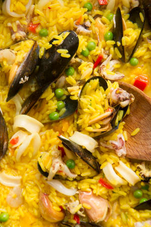 Presentation of a dish of Spain, paella being cookedの写真素材
