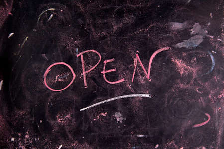 Written graphic opening, with colorful chalk on blackboardの写真素材