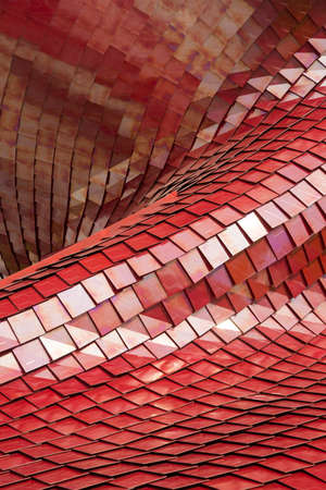 Covering of a building with the use of modern tiles of red colorの写真素材