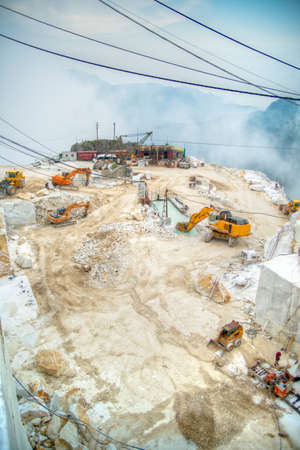 Broad view of the process in the white marble quarries in Carrara Italyの写真素材