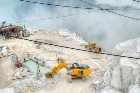 Broad view of the process in the white marble quarries in Carrara Italyの写真素材