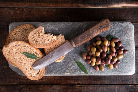 Aperitif made of bread with mixed olives in brine of Tuscany Italyの写真素材