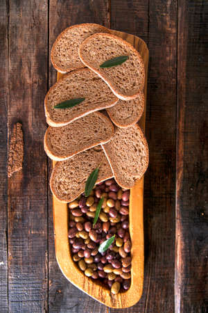 Aperitif made of bread with mixed olives in brine of Tuscany Italyの写真素材