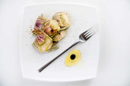 Presentation of a side dish made of fresh artichokesの写真素材