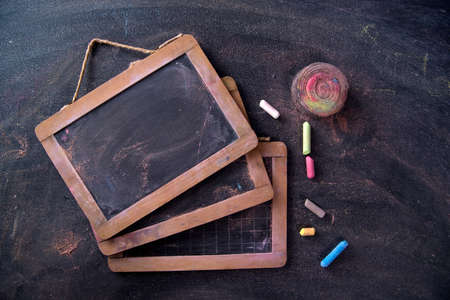Presentation of small antique school blackboards of the past with chalk and selvedgeの写真素材