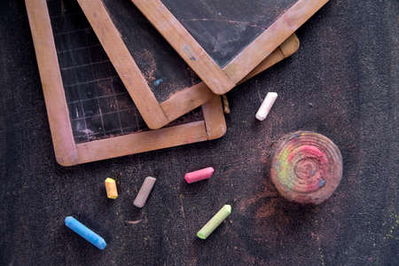 Presentation of small antique school blackboards of the past with chalk and selvedgeの写真素材