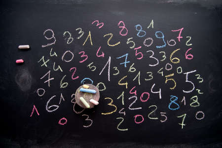 Graphic representation with chalk on blackboard with colorful numbersの写真素材