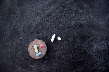 Old and used blackboard dirty school white chalk dustの写真素材