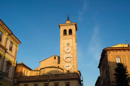 The church of San Francesco with the tower clocks in Tolentino Italyの写真素材