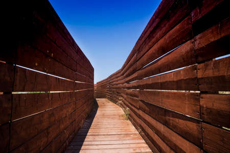 Walk with wooden guards to not disturb the birds in the parkの写真素材