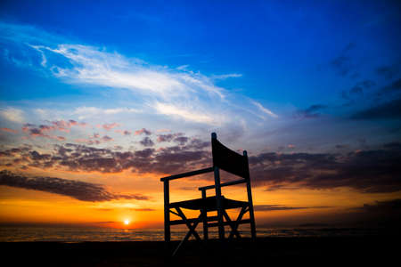 Chair on the beach seen at the sunset of the winter seaの写真素材