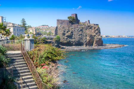 View of the ancient and historic Castle on the coast of Aci Castello in Sicily Italyのeditorial素材