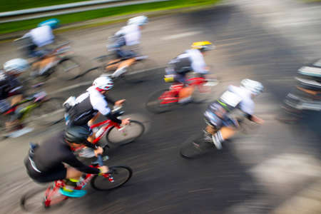 Photo with blur on a competitive road bike raceの写真素材