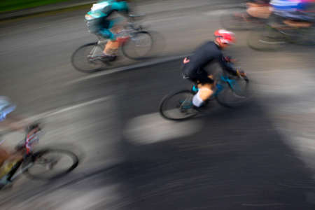 Photo with blur on a competitive road bike raceの写真素材