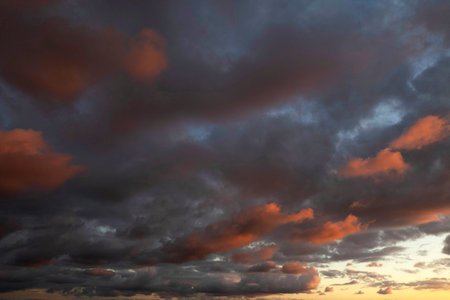Photographic documentation of dark clouds during the sunset phaseの写真素材