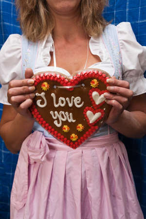 Gingerbread heart and woman with costumeの写真素材