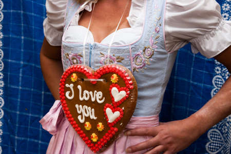 Gingerbread heart and woman with costumeの写真素材