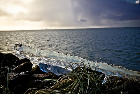 Drifting ice at the end of the winter at sunsetの写真素材
