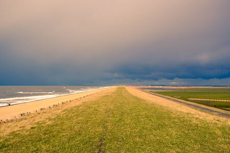 Heavy Storm Clouds over a Dutch dike near the sea