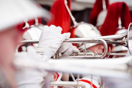 Close up and details of playing musicians, instruments in a marching, show band or music bandの写真素材