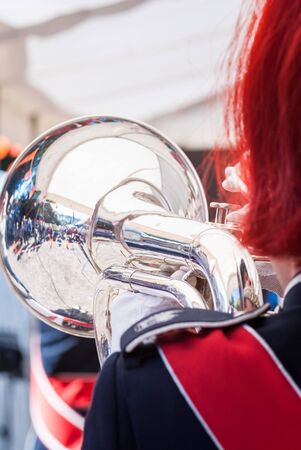 Close up and details of playing musicians, instruments in a marching, show band or music bandの写真素材