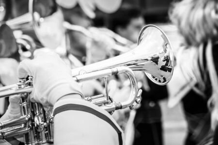 Close up and details of playing musicians, instruments in a marching, show band or music bandの写真素材