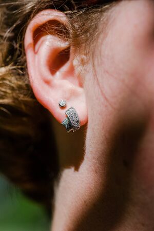 Details from the bride wedding dress and accessories in the sunの写真素材