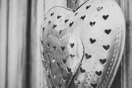 Stylized ironwork in and a heart shape to use as deco for a wedding or adornment for a garden backgroundの写真素材
