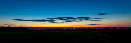 Heroic summer evening with beautiful sunset and twilight colors above the RhÃ´ne vally. In the distance view of the Ardeche and the city of Valenceの写真素材