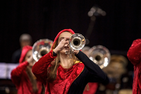 Details of a performing wind band during a performance or concert with various wind instrumentsの写真素材