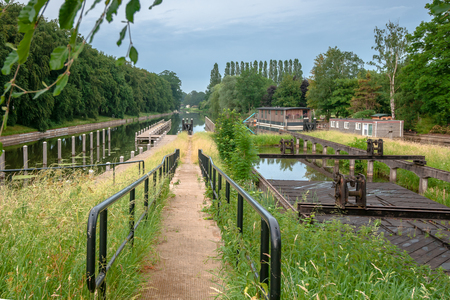 Industrial old sluice complex and bridges from the industrial revolution with rivets and old craftsmanship. Attractive picture of the Dutch waterways 'Katerveer'の写真素材