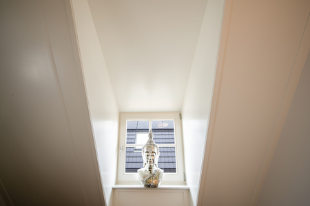 Stylized head bust of an eastern god as decoration and a modern homeの写真素材