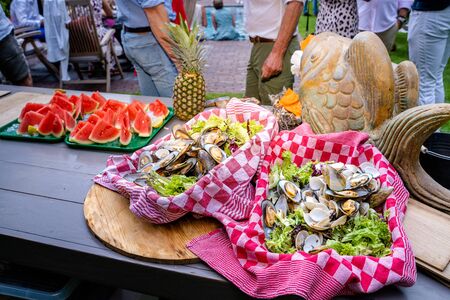 Tasty summer BBQ family together during garden partyの写真素材