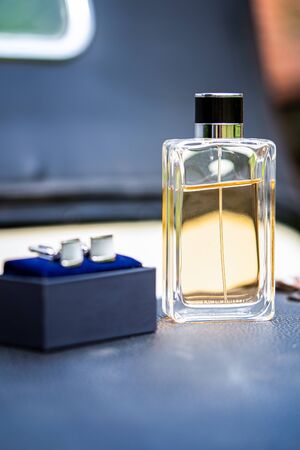 Beautiful square men perfume bottle. Beautiful luxury perfume bottle. Process of making perfumes.の写真素材