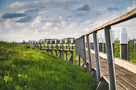 Old harbor of a former island in the Netherlands. Old buildings, the harbor mouth and the jetties...