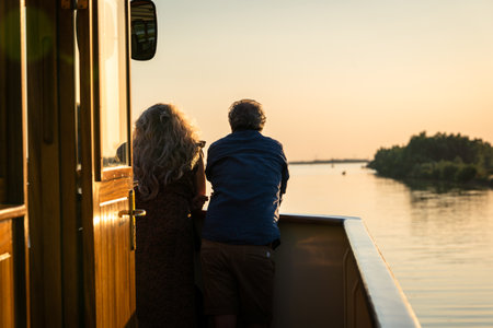 Balmy summer evening with beautiful romantic sunlight from the deck of a river cruise ship