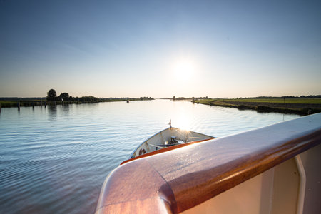 View over the estuary of the river IJssel and its delta from the balustrade of a boatの写真素材